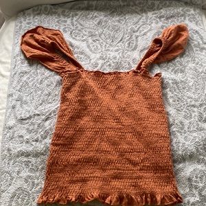 Billabong top with on or off the shoulder sleeves.